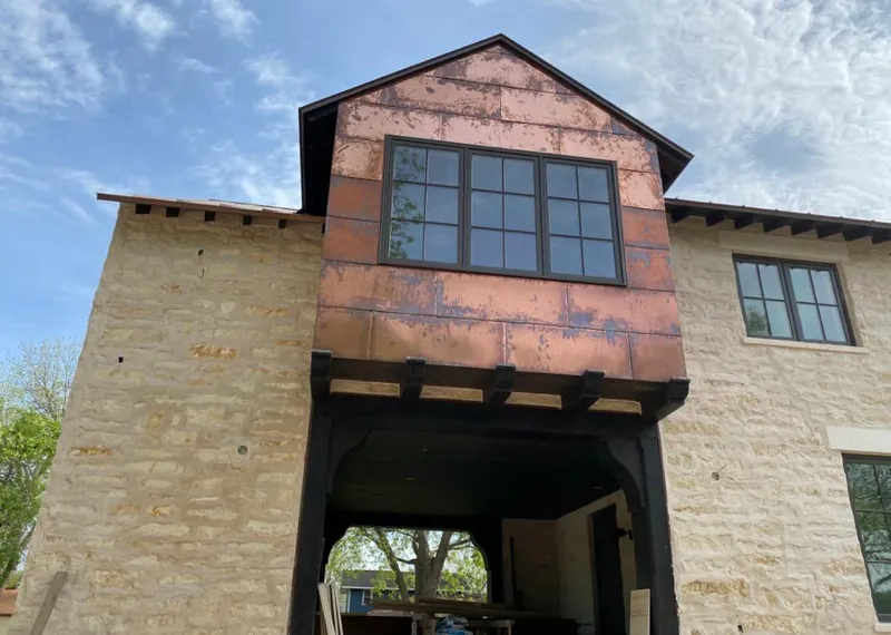 Copper metal panel facade on a stone building for Metal Roof Coating in Payson