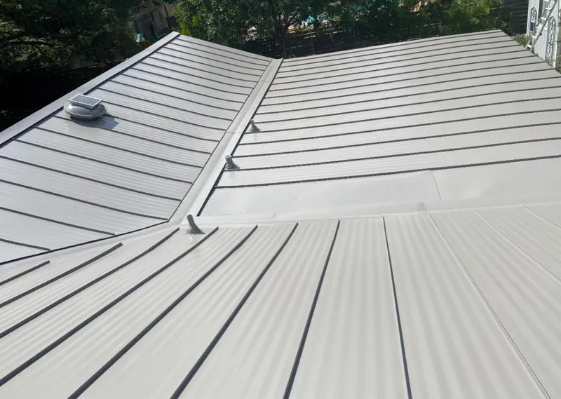 Solar attic fan installed on a metal roof for Roof Ventilation in Payson